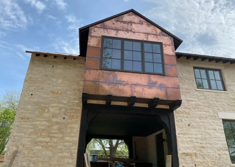 Copper metal panel facade on a stone building for Skylight Installation in Selah